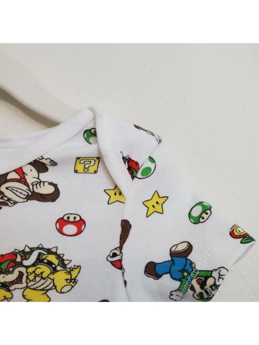 Super Mario Nintendo all-over-print baby onesie